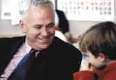 Photo shows Richard Prebble talking to a small boy. 