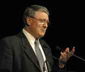 Photo shows Richard Prebble speaking at a conference. 
