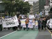 Photo shows protesters against the war in Iraq marching down Wellington's Lambton Quay. 