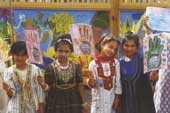 Photo of four young girls in ethnic costume. 