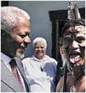 Photo shows Maori Warrier greeting Kofi Annan. 
