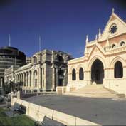 Photo shows three parliament buildings. 