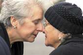 Photo shows Dame Silvia Cartwright receiving a hongi from a Maori woman. 